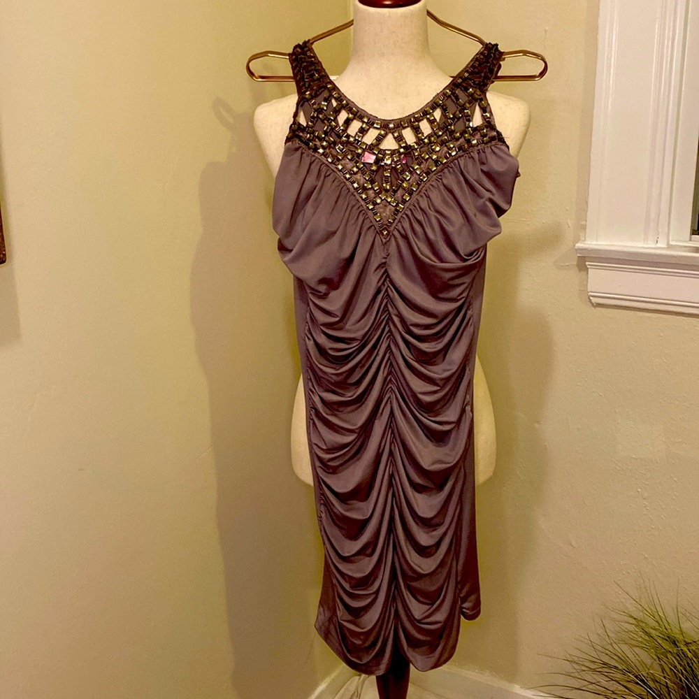 Tight fitting purple dress.